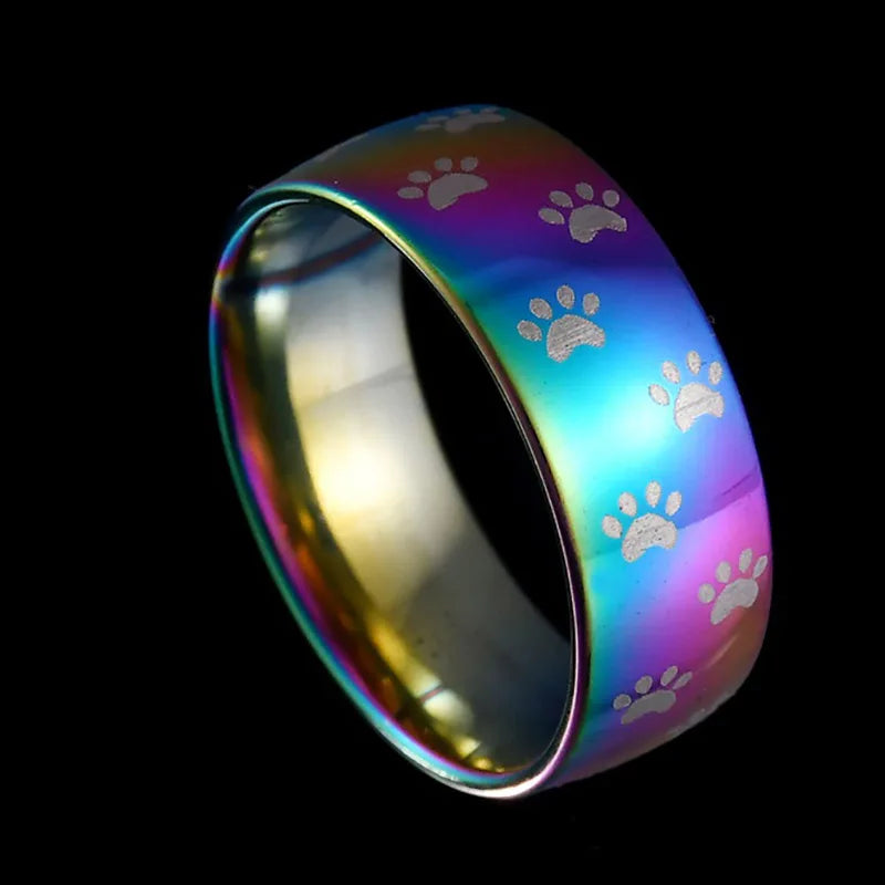 Handmade rainbow-colored stainless steel ring with paw print.